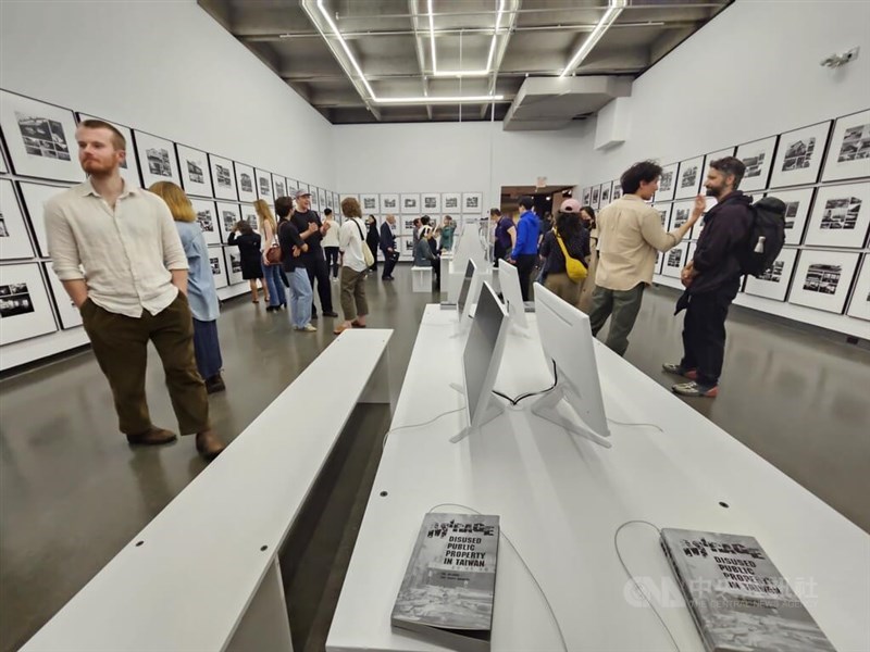 Visitors to the Museum of Vancouver on Thursday look through the photos of Taiwanese artist Yao Jui-chung's "Mirage: Disused Public Property in Taiwan" exhibition. CNA photo May 30, 2024