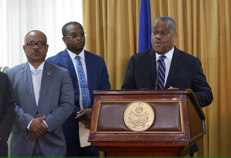 Garry Conille (right) addresses the audience during a ceremony with members of the transition council, where he is presented as Haiti's interim Prime Minister, in Port-au-Prince, Haiti June 3, 2024. Photo: Reuters