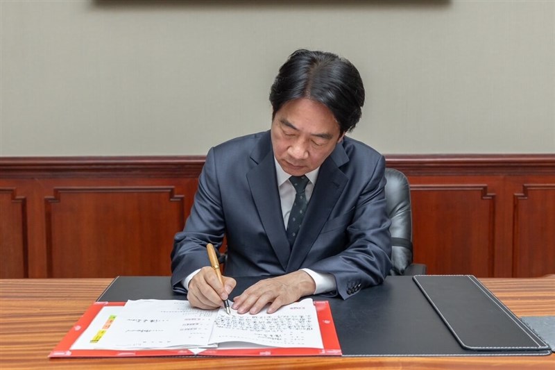 President Lai Ching-te signs a document to seek Constitutional Court's review on bills passed by the Legislature to strengthen the law-making body's power in Taipei Monday. Photo courtesy of Presidential Office June 24, 2024