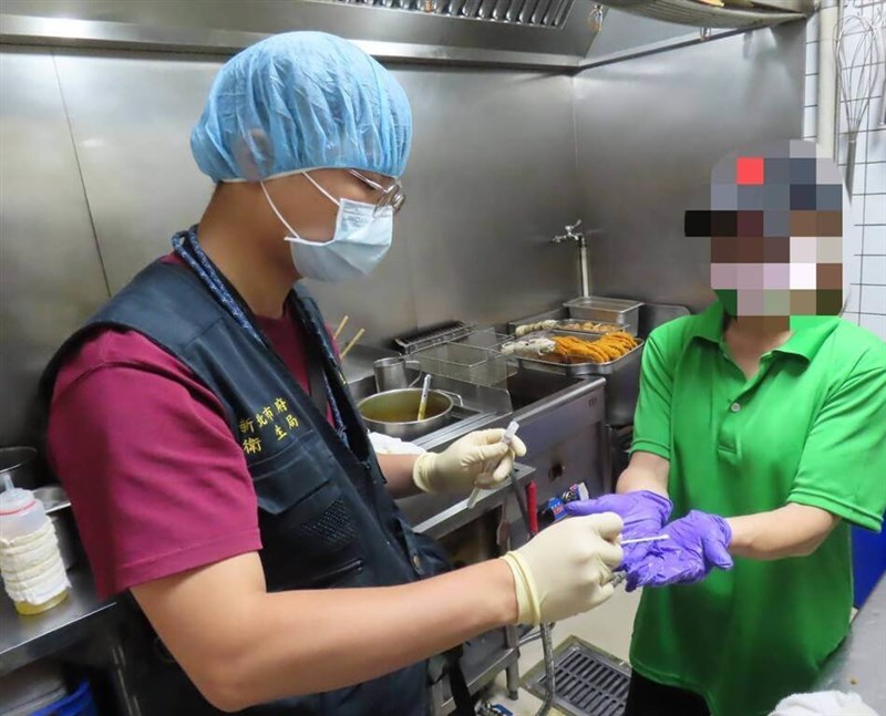 A health official swab hands of a worker at the curry restaurant linked to the food poisoning in New Taipei. Photo courtesy of New Taipei City Department of Health June 24, 2024