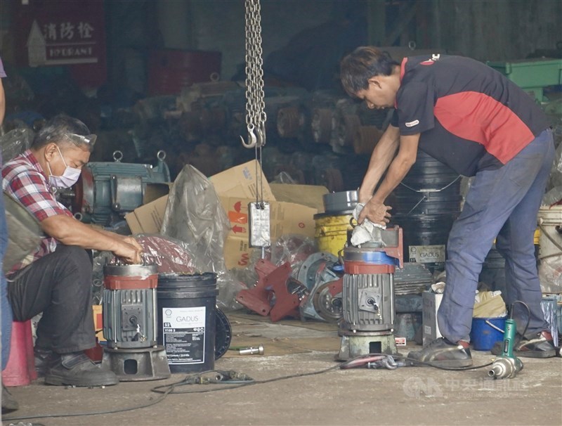 Workers work at a motor factory. CNA file photo