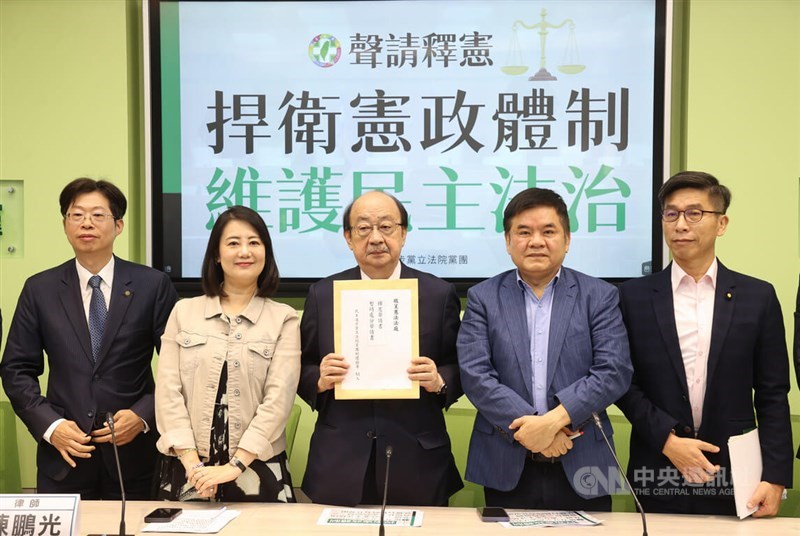 DPP legislative caucus whip Ker Chien-ming (center), party lawmakers and a a legal counsel are pictured at a news conference in Taipei Wednesday. CNA photo June 26, 2024