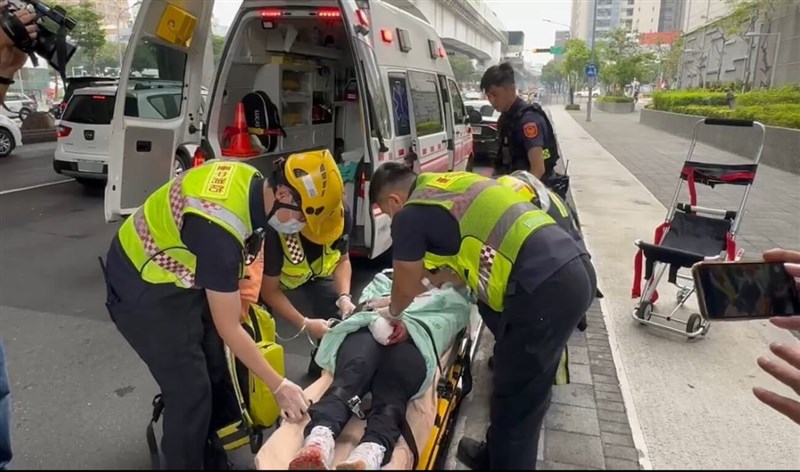 First responders prepare to move a wounded passenger on a stretcher to an ambulance outside a Taichung metro station on May 21, 2024. Photo courtesy of a private contributor