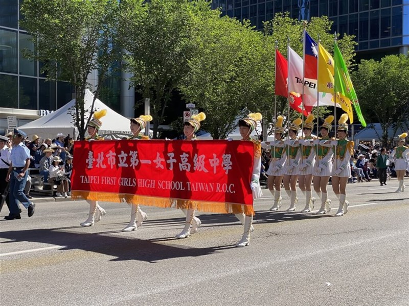 The Taipei First Girls High School Marching Band, Honor Guards and Color Guards marches down Calgary's streets at the Calgary Stampede Parade Friday. Photo courtesy of Taipei First Girls High School Marching Band, Honor Guards and Color Guards, July 6, 2024