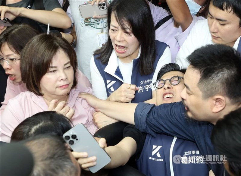 Ruling and opposition lawmakers brawl over proposed amendments to the Public Officials Election and Recall Act at the Legislative Yuan in Taipei on Monday. CNA photo July 8, 2024