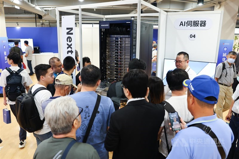 Hon Hai shareholders gather around a server displayed at the company's headquarters in New Taipei for the annual general meeting on May 31, 2024. CNA file photo