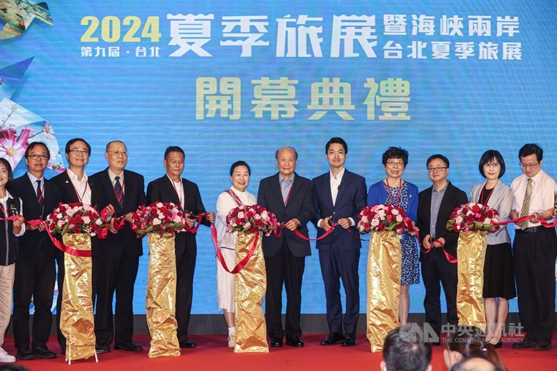 Straits Exchange Foundation Vice Chairman and Secretary-General Luo Wen-jia (third right) attends the opening ceremony of the Summer Travel Expo in Taipei Friday. CNA photo July 12, 2024