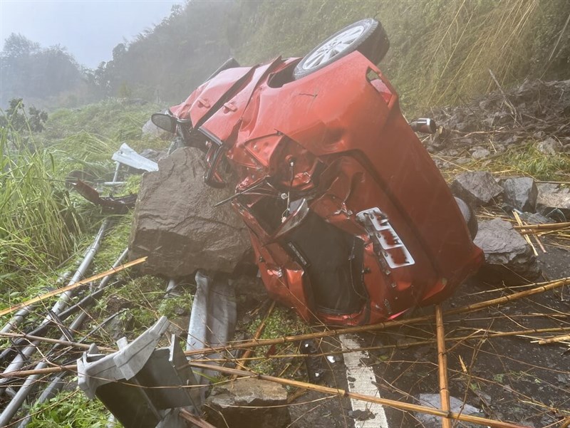 The car driven an Alishan Forest Railway employee is overturned after being hit by rocks Friday. Photo courtesy of a private contributor July 26, 2024