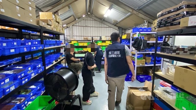 A police officer checks through a factory raided in Taichung in May. Source: Local enforcement authorities July 31, 2024