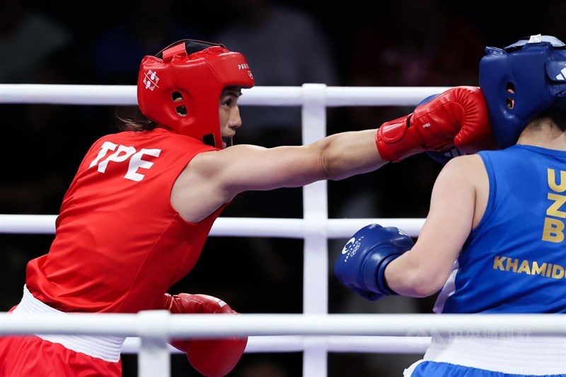 Taiwan boxer Chen Nien-chin (left) strikes in a semifinal match against rival Navbakhor Khamidova of Uzbekistan at the Paris Olympics on Saturday. CNA photo Aug. 4, 2024