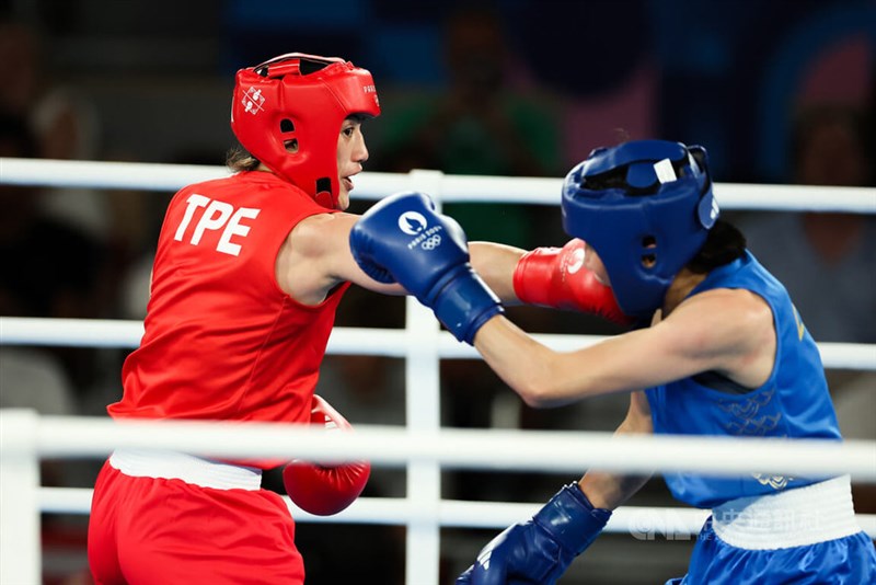 Taiwanese boxer Chen Nien-chin (left) clinched a bronze medal at the Paris Olympics on Tuesday following a semifinal loss to China's Yang Liu (right) in the women's 66-kilogram weight class.