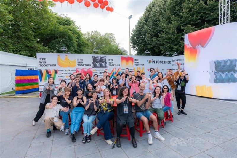 The staff of the Taiwan Pavilion at the Cultural Olympiad in Paris, as well as Neo Wu (front center, in black), the chief coordinator of administration and production, pose for a group photo. Photo courtesy of Neo Wu, Aug. 18, 2024