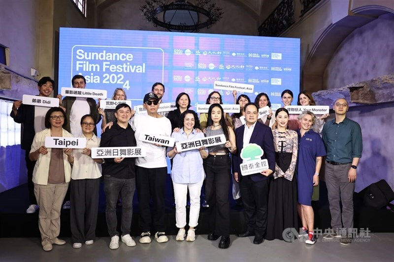 Kim Yutani (back row, fifth left), Sundance's director of programming, Kevin Lin (front row, third left), one of the founders of G2Go Entertainment, and Taiwanese-American director Sean Wang (back row, fourth left) are seen among event organizers and actors in a group photo taken at a Tuesday press event. CNA photo Aug. 20, 2024