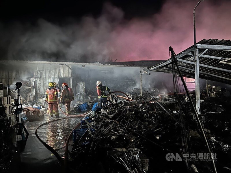 Firefighters put out a fire that broke out at a home in New Taipei's Xizhi District. Photo courtesy of the police