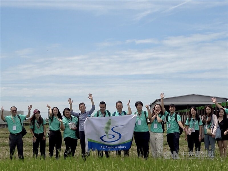 Taiwanese agricultural ambassadors take a photo together outside the rice mill on Wednesday. CNA photo Aug. 29, 2024