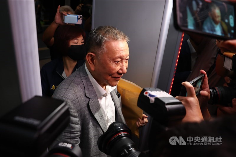 Core Pacific Group Chairman Sheen Ching-jing (front) is surrounded by members of the media as he arrived at the Taipei District Prosecutors Office for questioning on Wednesday night. CNA photo Aug. 28, 2024