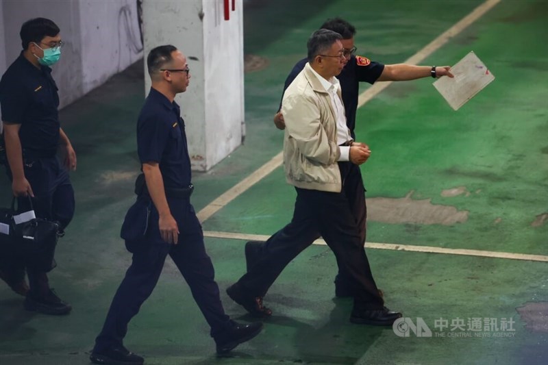 TPP Chairman Ko Wen-je is seen handcuffed and escorted by police at the Taipei District Court on Thursday to be detained. CNA photo Sept. 5, 2024