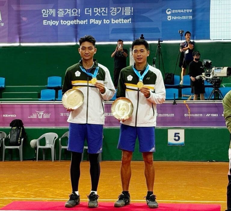 Yu Kai-wen (right) and Kuo Chien-chun post for photos after winning gold medals in the men's doubles event of the 2024 World Soft Tennis Championships in Anseong City, South Korea, on Saturday. Photo courtesy of Taiwan's Sports Administration Sept. 7, 2024