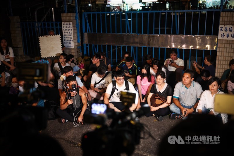 Taiwain People's Party Chairman Ko Wen-je's supporters sit at the entrance of the Taipei Detention Center in New Taipei on Sept. 6, a day after he was sent to the facility while prosecutors investigate alleged corruption during his time as Taipei Mayor. CNA photo Sept. 6, 2024