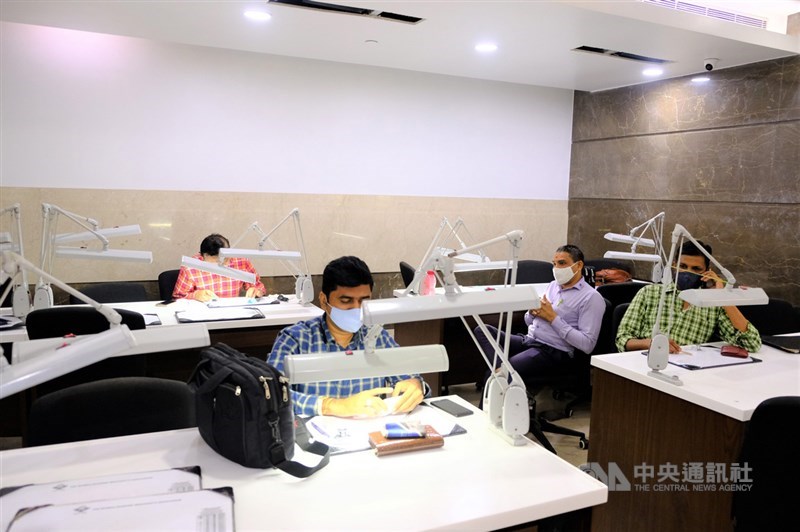 Indian employees work away in an office in this CNA file photo