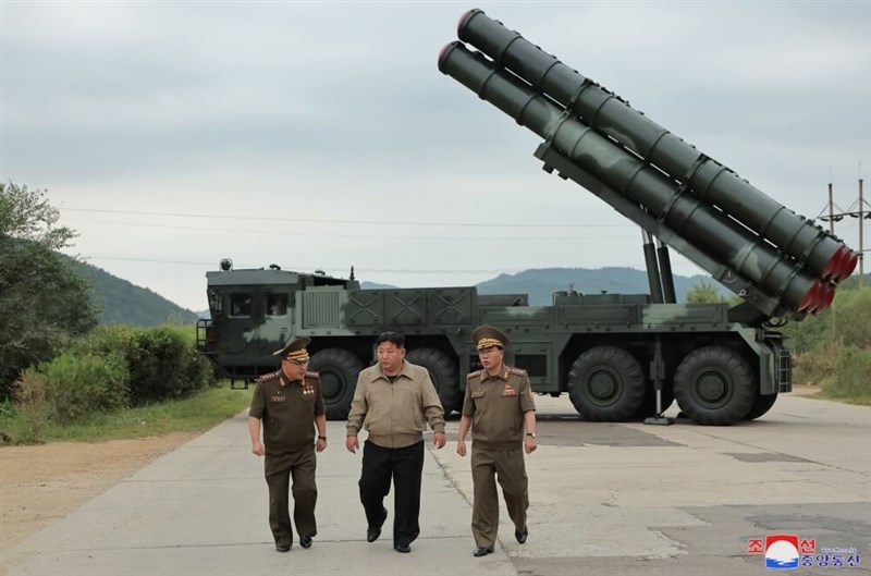 North Korean leader Kim Jong Un (center) inspects a rocket test launch on Friday. Photo courtesy of KCNA