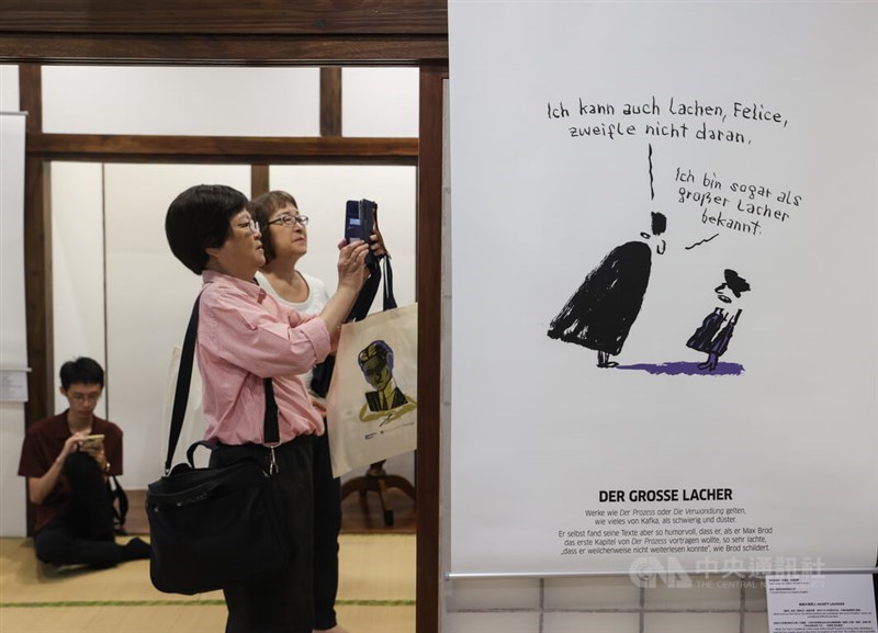 Event attendees snaps photos at the "Kafka in Taiwan" exhibition. CNA photo Sept. 14, 2024