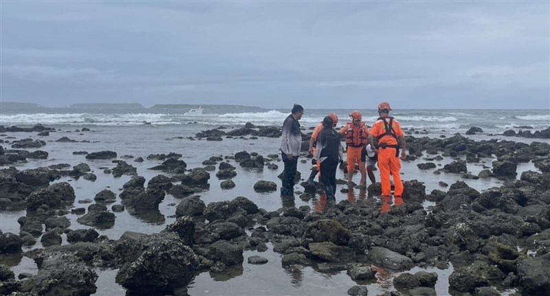 Members of Taiwan's Coast Guard rescue four individuals after their fishing boat ran aground. Photo courtesy of Coast Guard's 7th Patrol Unit