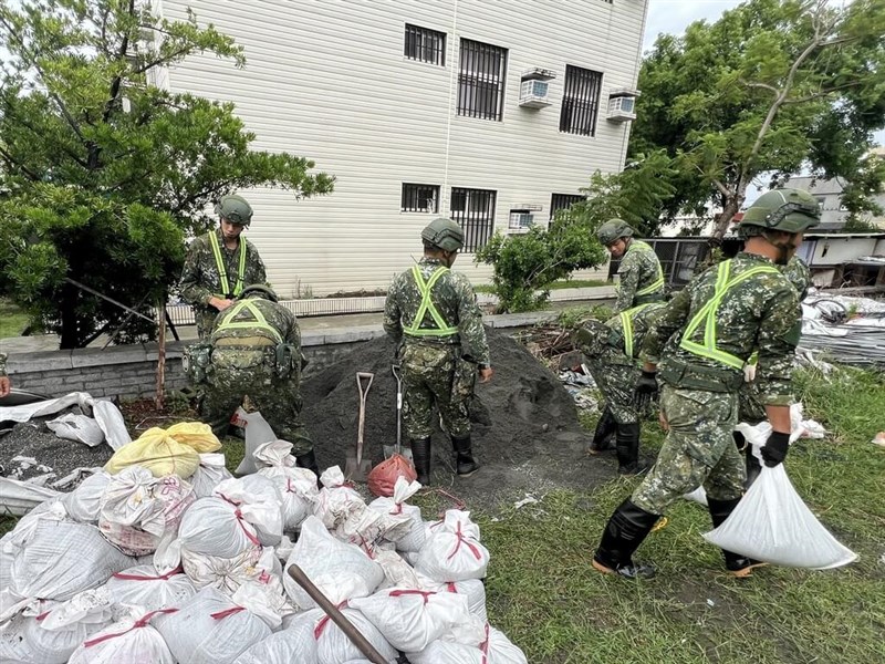 Military personnel assist with setting up sandbags to alleviate flooding in preparation for the incoming typhoon. Photo courtesy of Army Command Headquarters Oct. 1, 2024