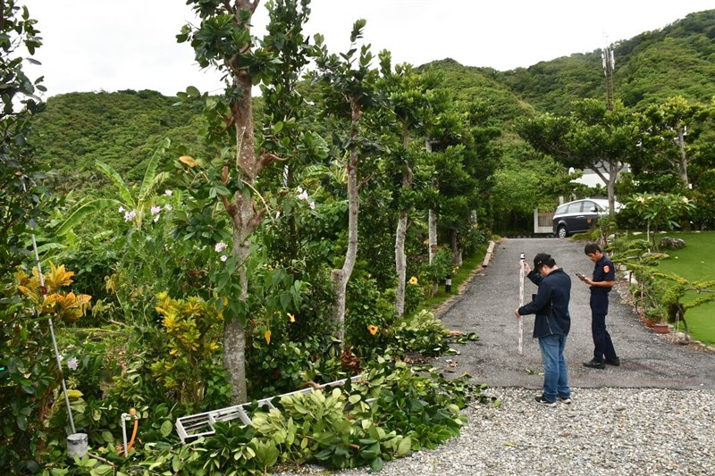 A policeman and a man document the scene where a local resident in his 70s was seriously injured after falling from a ladder in Shoufeng Township, Hualien County, on Tuesday. Photo courtesy of a private contributor Oct. 2, 2024