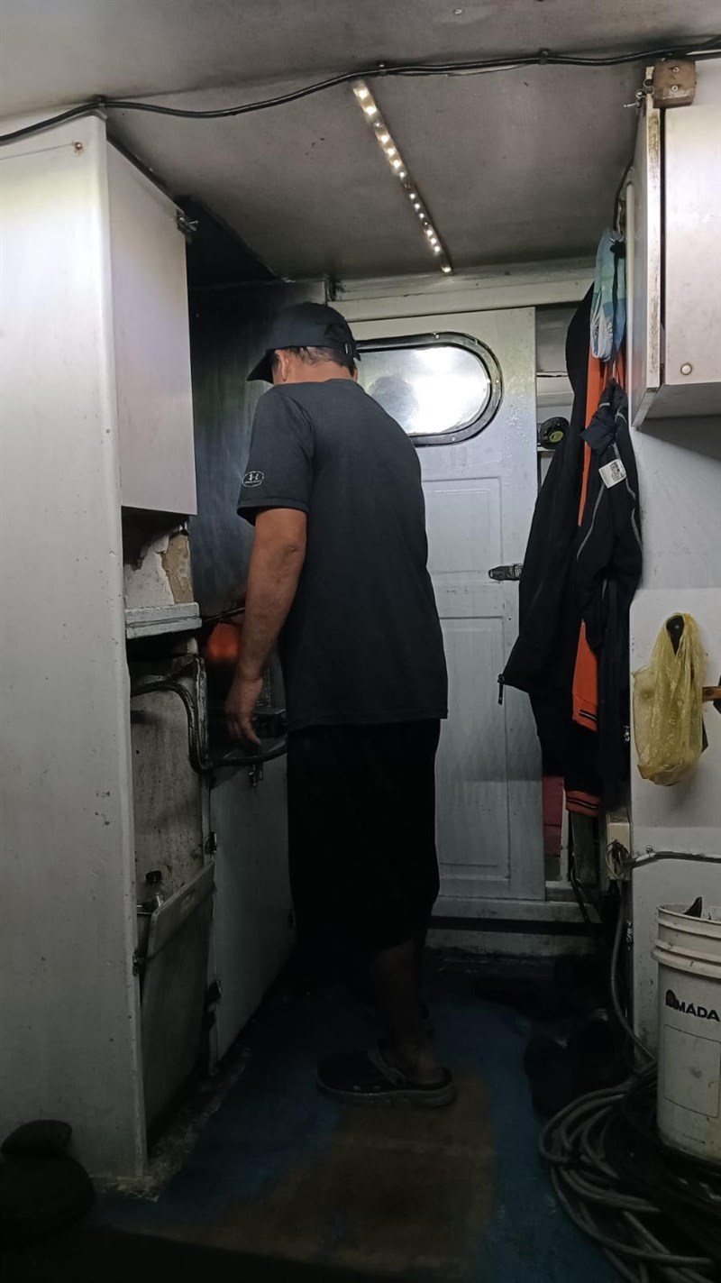 One of the crew members is seen on the ship during the typhoon cooking in the galley of a CT3 type boat Thursday. Photo courtesy of a private contributor October 3, 2024