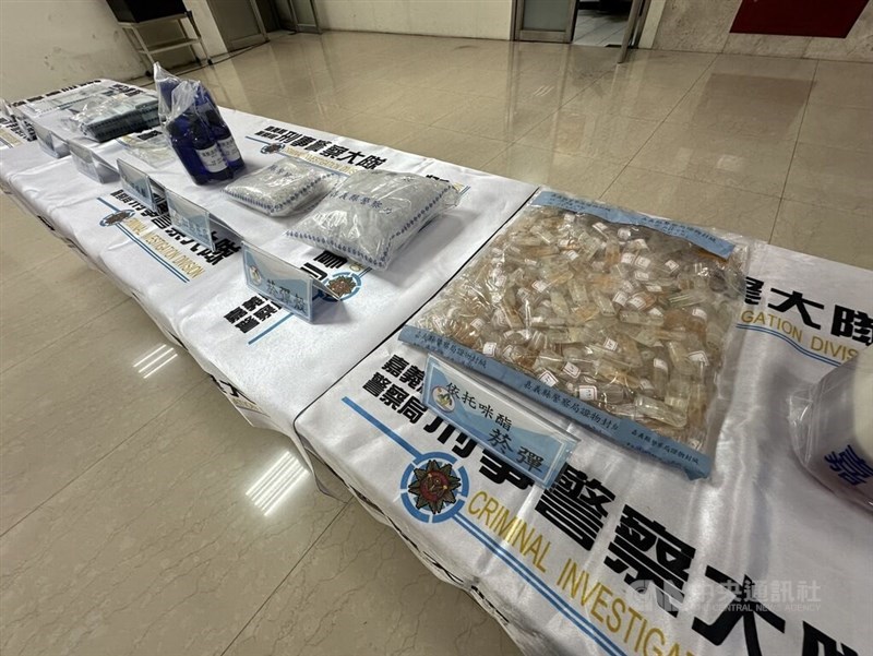 Narcotics and other evidence seized by the Criminal Investigation Bureau staff are displayed on tables at a press conference in Taipei on Friday. CNA photo Oct. 4, 2024