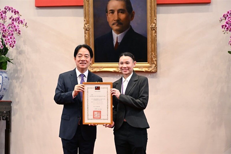 President Lai Ching-te (left) and badminton player Tai Tzu-ying display a certificate for Tai's appointment as an ambassador-at-large at the Presidential Office in Taipei on Monday. Photo courtesy of the Presidential Office Oct. 7, 2024