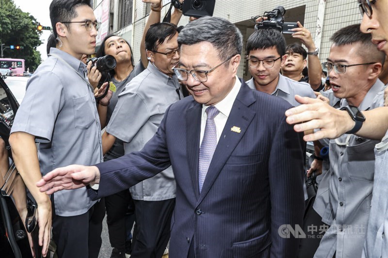 Prime Minister Cho Jung-tai (front center) leaves a Taipei restaurant without answering any questions from the press after Friday's lunch with cross-party leaders. CNA photo Oct. 11, 2024.