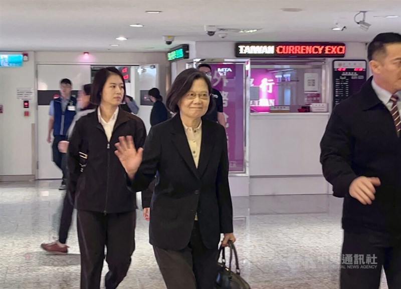 Former President Tsai Ing-wen (center) waves to the press as she gets ready to depart for Europe at the Taoyuan International Airport on Saturday. CNA photo Oct. 12, 2024