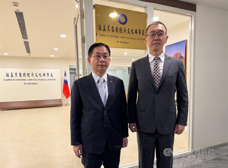 Taiwan's top representative to India Baushuan Ger (left) and Chang Chun-yu (right), director of the Taipei Economic and Cultural Center in Mumbai, stand at the entrance of the center Thursday. CNA photo Oct. 17, 2024