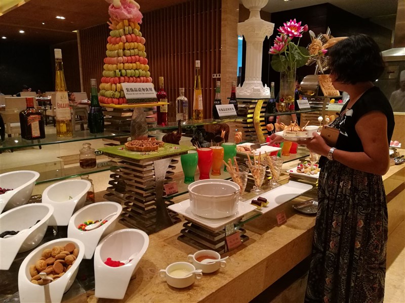 A woman selects food at a buffet offered by a five-star hotel in Dongguan, Guangdong Province, China. CNA file photo