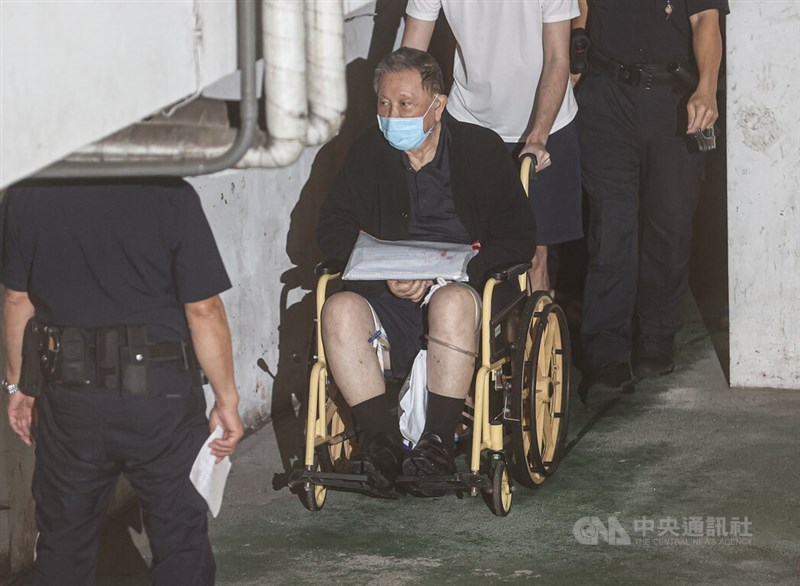 Real estate tycoon Sheen Ching-jing is pushed in a wheelchair after he arrived at the Taipei District Court Wednesday afternoon. CNA photo Oct. 23, 2024