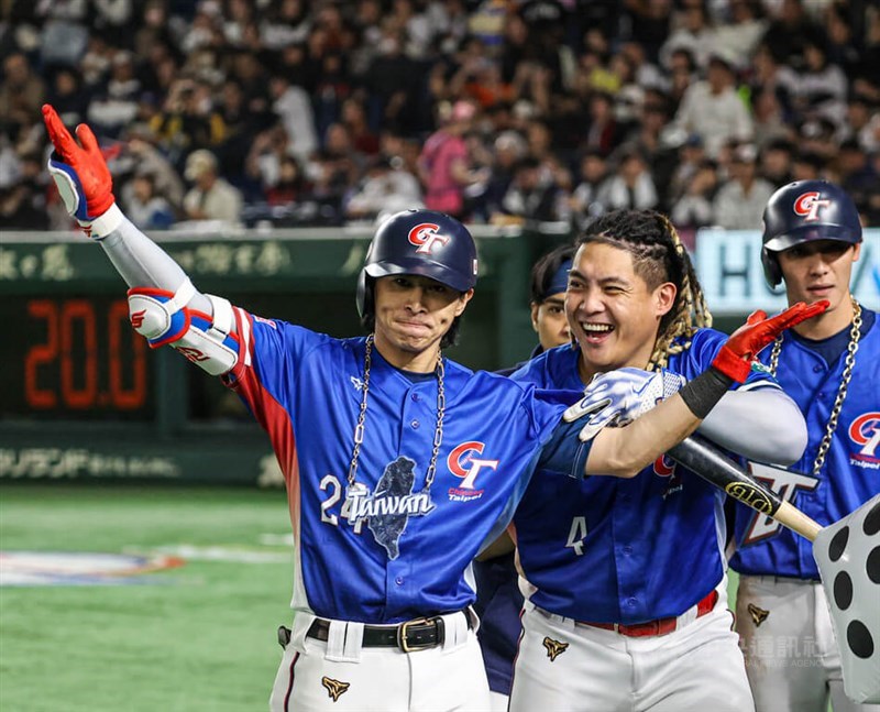 Team Taiwan Captain Chen Chieh-hsien (left) celebrates his three-run homer against Japan during Sunday's Premier12 final in Tokyo. CNA photo Nov. 25, 2024