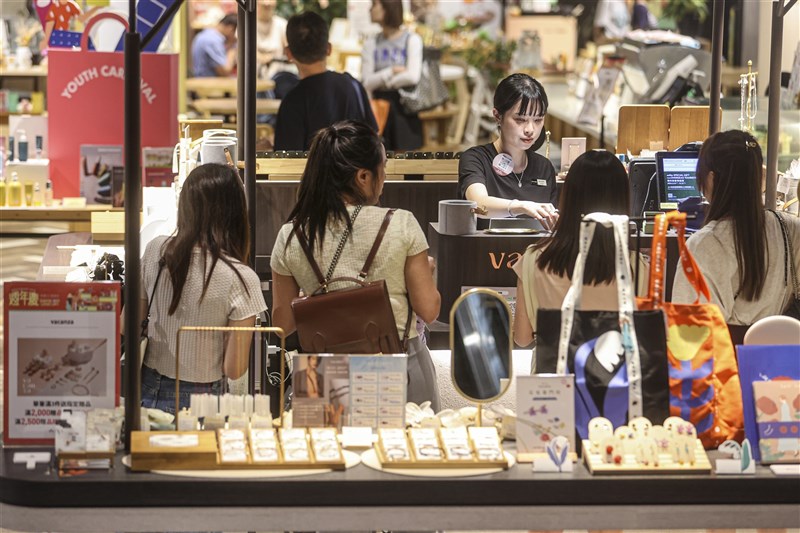 Consumers shop in this CNA file photo