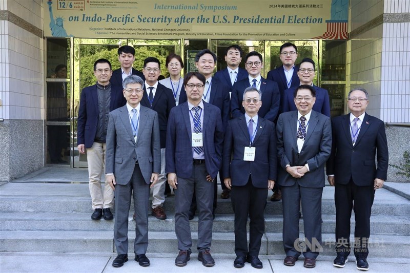 Scholars gather for a group photo outside the Institute of International Relations at National Chengchi University (NCCU) in Taipei Friday. Photo courtesy of Institute of International Relations, NCCU Dec. 6, 2024