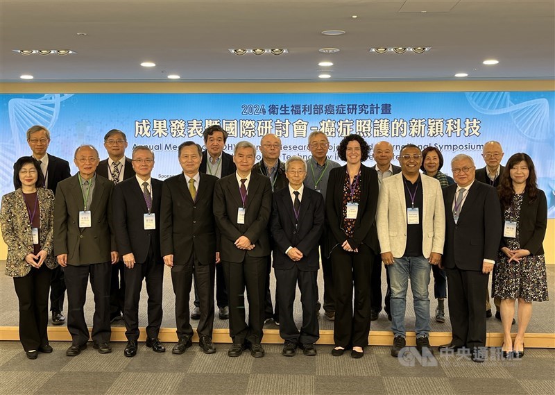 Medical experts pose for a group photo while attending a symposium held by the National Health Research Institutes (NHRI) in Taipei Saturday. CNA photo Dec. 7, 2024