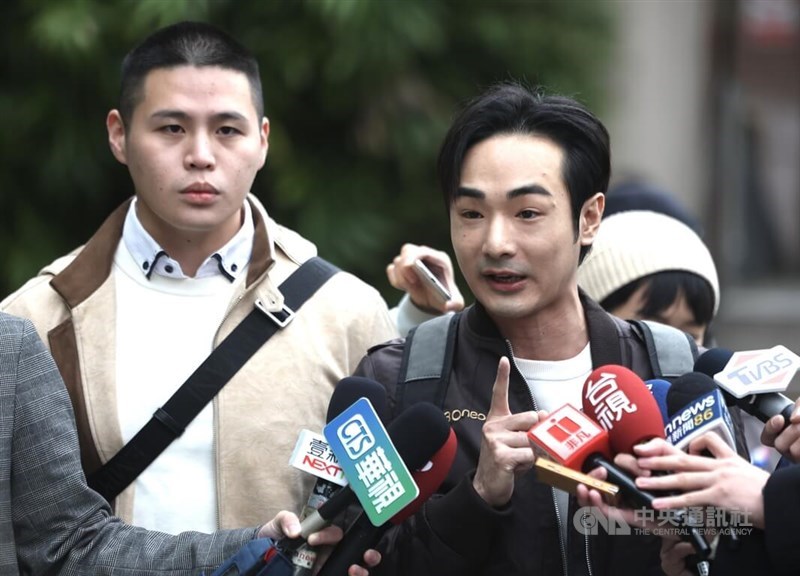 Anti-CCP YouTuber, Pa Chiung (right) and Taiwanese rapper Chen Po-yuan (left) speak to local press after making a viral splash on Youtube with their documentary. CNA photo Dec. 8, 2024