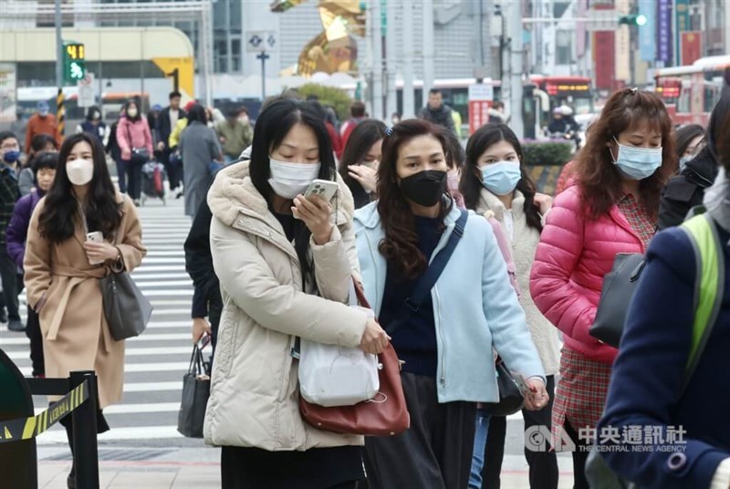 People are seen bundled up in warm clothing amid the recent chilly weather. CNA file photo