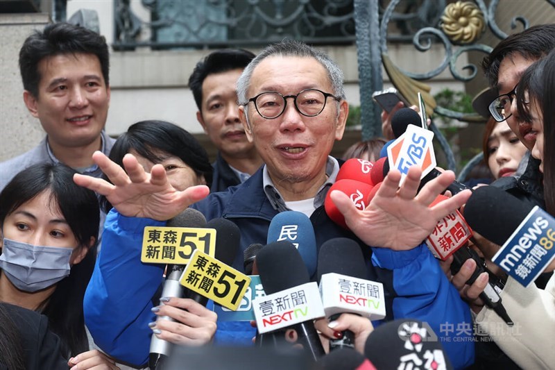 Taiwan People's Party Chairman Ko Wen-je (front center) speaks to the press in front of his home after being granted bail Friday morning. CNA photo Dec. 27, 2024