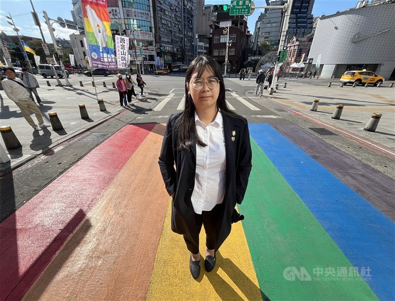 Claire Chiu, a transgender woman, stands on a rainbow crossing that celebrates the LGBTQ+ community in Taipei in mid-January. CNA photo Jan. 28, 2025