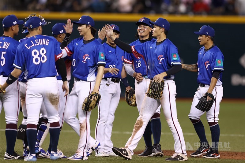 Team Taiwan players celebrate their win over South Africa at the Taipei Dome on Saturday. CNA photo Feb. 22, 2025