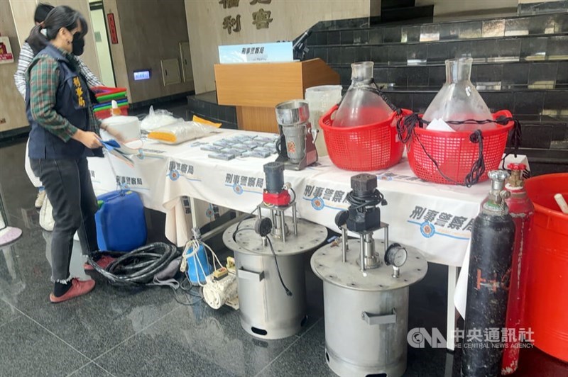 Law enforcement officers raid a suspected amphetamine production site in Pingtung County. Photo courtesy of local authorities