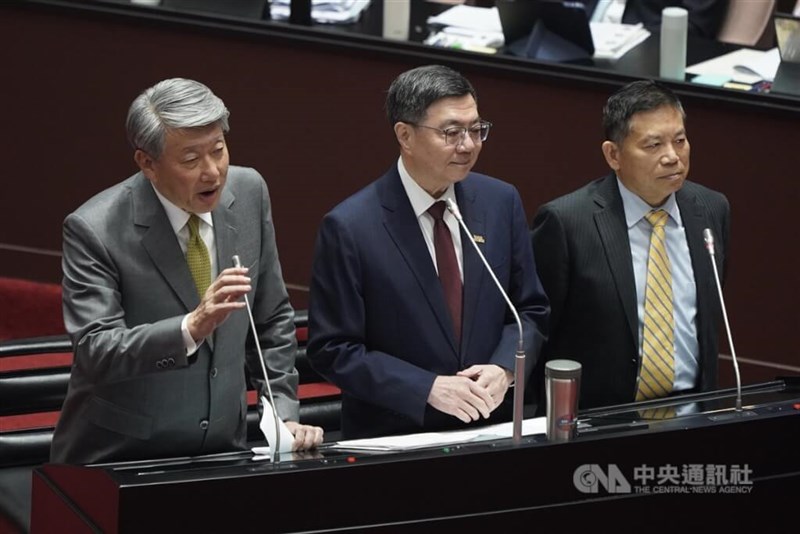 Economics Minister Kuo Jyh-huei (郭智輝, left) comments on TSMC's investment in the United States during a legislative session Tuesday. CNA photo March 4, 2025