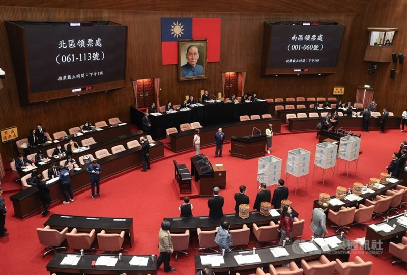 A roll-call vote on the reconsideration of the Election and Recall Act is conducted at the Legislative in February. CNA file photo