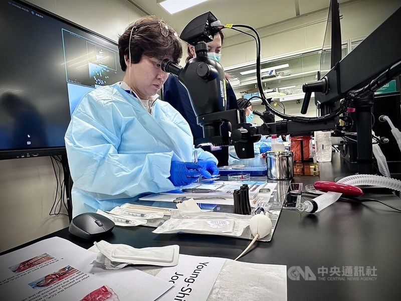 A student (left) operates on a bionic teaching aid at the National Applied Research Laboratories in Taipei on Monday. CNA photo March 11, 2025